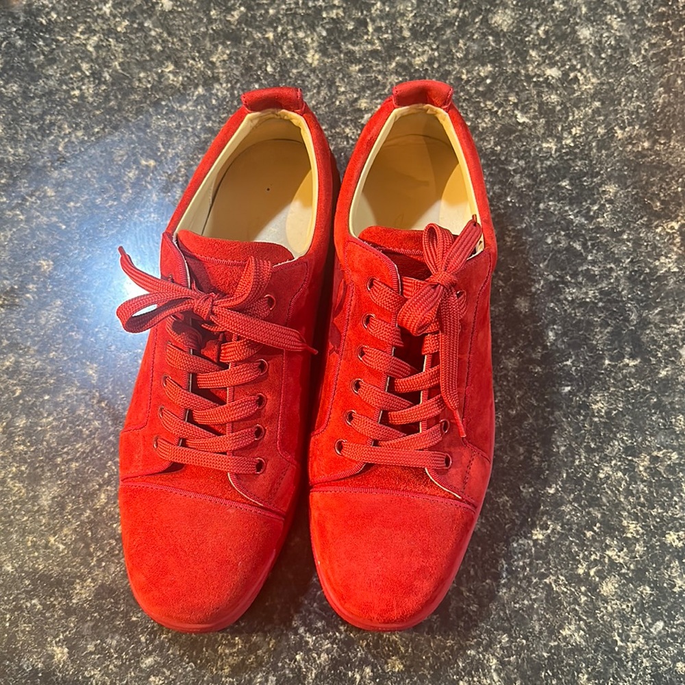 Christian Louboutin red bottoms.